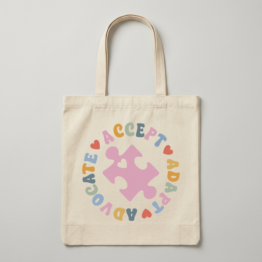 Carry your values with this thoughtfully designed tote bag. The "Acceptance Advocate ABD Adapt" message celebrates inclusivity, mindfulness, and personal growth. Perfect for daily use whether heading to work, running errands, or heading to the gym. Durable canvas construction withstands everyday wear, while spacious interior compartments keep your essentials organized. The comfortable handles make it easy to carry, and the timeless design pairs well with any outfit. A meaningful accessory that sparks conver