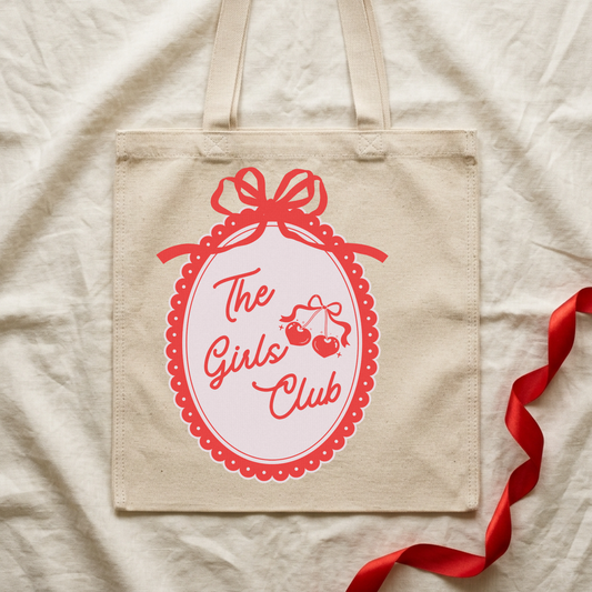 Carry your crew with style. This durable canvas tote features "The Girls Club" graphic, perfect for beach days, shopping trips, or everyday adventures. Spacious interior keeps your essentials organized, while sturdy handles ensure comfortable carrying. A timeless accessory that celebrates friendship and fun.